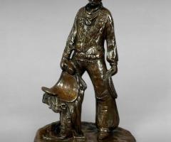 Late 20th-Century Resin Cowboy Sculpture Holding Saddle by Terri Blem
